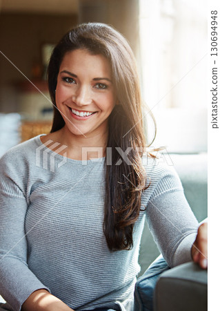 Portrait, woman and relax on sofa, happiness and comfortable in living room, weekend break and smile at home. Young female, girl and on couch in lounge, happy and confidence with sunshine and calm Portrait, woman and relax on sofa, happiness and comfortable in living room, weekend break and smile at home. Young female, girl and on couch in lounge, happy and confidence with sunshine and calm 130694948