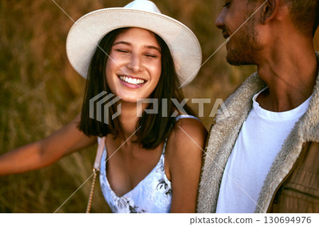 Couple, love and happy people smiling and travel together enjoying an outdoor date during sunset. Young man and woman on a romantic vacation on a morning walk feeling happiness in summer Couple, love and happy people smiling and travel together enjoying an outdoor date during sunset. Young man and woman on a romantic vacation on a morning walk feeling happiness in summer 130694976