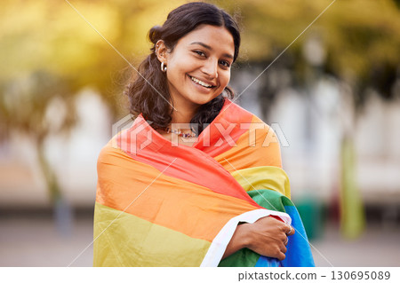 Love, nature and portrait of woman in pride flag, smile and non binary lifestyle of freedom, peace and equality in Brazil. Rainbow, park and summer, happy girl in gay and lgbt community protest. 130695089
