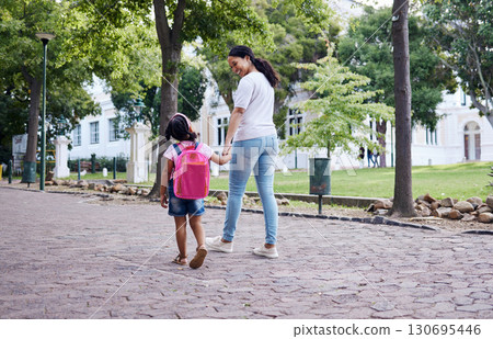Kindergarten, student and mother with daughter walking to school, relax and bonding while holding hands. First day, elementary and girl with mama on commute, morning travel, talking and sweet Kindergarten, student and mother with daughter walking to school, relax and bonding while holding hands. First day, elementary and girl with mama on commute, morning travel, talking and sweet 130695446