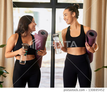 Women or friends talking in yoga class in training gear for fitness, exercise or sports teamwork and wellness. Pilates, meditation and healthy gen z or young people chat of holistic workout together 130695452