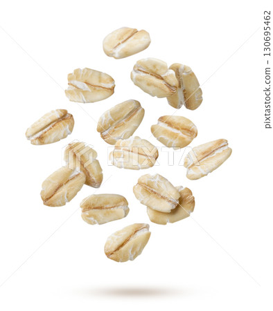 Oat flakes flying close-up on a white. Isolated Oat flakes flying close-up on a white. Isolated 130695462