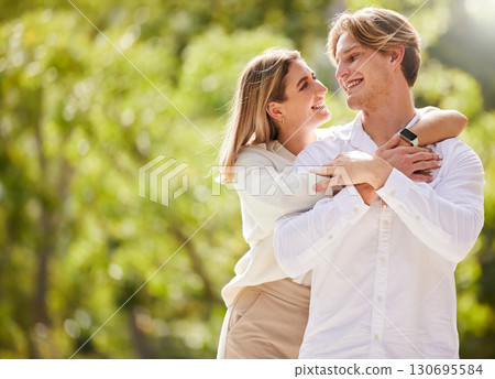 Nature, smile and couple hug for happy, quality time and bonding on weekend, vacation and holiday together. Dating mockup, love and young man and woman hugging, relax and romantic embrace in park Nature, smile and couple hug for happy, quality time and bonding on weekend, vacation and holiday together. Dating mockup, love and young man and woman hugging, relax and romantic embrace in park 130695584