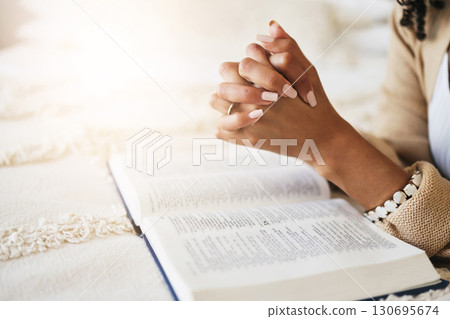Prayer, bible and hands praying for religion, hope or help, spiritual or faith in home. God, christian and female or woman worship Jesus Christ or Holy Spirit with catholic text or book for peace. Prayer, bible and hands praying for religion, hope or help, spiritual or faith in home. God, christian and female or woman worship Jesus Christ or Holy Spirit with catholic text or book for peace. 130695674
