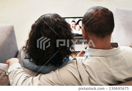 Laptop, couple and video call on home sofa for communication, network connection and webinar. Man and woman grandparents in lounge with app for virtual conversation, distance family chat or to relax Laptop, couple and video call on home sofa for communication, network connection and webinar. Man and woman grandparents in lounge with app for virtual conversation, distance family chat or to relax 130695675