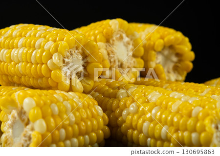 Fresh Hot Boiled Corn Cob on Black Background Fresh Hot Boiled Corn Cob on Black Background 130695863
