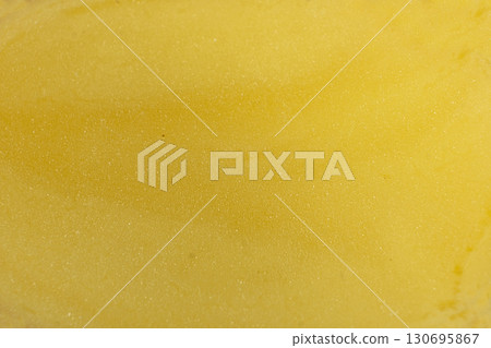 Fresh Cut Potato Macro Close-Up Yellow Background. 130695867