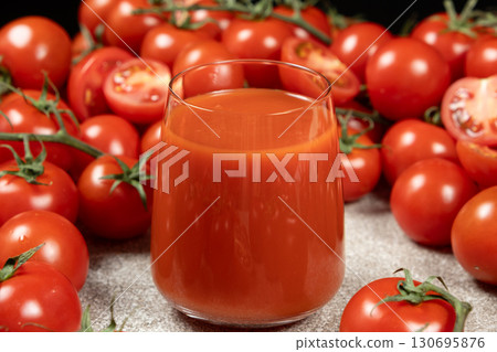Natural Tomato Drink and Raw Tomatoes. Healthy Lifestyle. Natural Tomato Drink and Raw Tomatoes. Healthy Lifestyle. 130695876