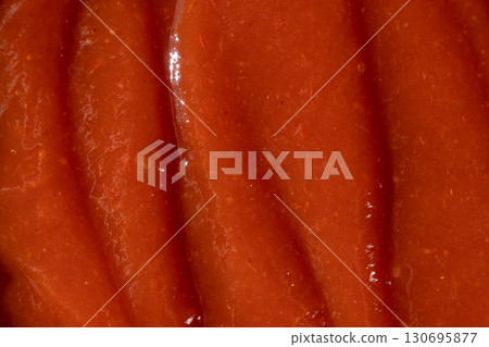 Red Ketchup Surface Close-Up. Ingredient Background for Design. 130695877