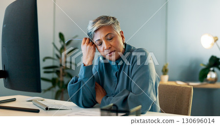 Stress, headache and mature businesswoman in office doing research for project with deadline at night. Burnout, exhausted and professional female designer with migraine working overtime in workplace. 130696014