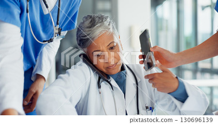 Senior woman, doctor and phone call in chaos, overworked or multi tasking in anxiety or stress at hospital. Tired mature female person, medical or busy healthcare worker in burnout or communication Senior woman, doctor and phone call in chaos, overworked or multi tasking in anxiety or stress at hospital. Tired mature female person, medical or busy healthcare worker in burnout or communication 130696139