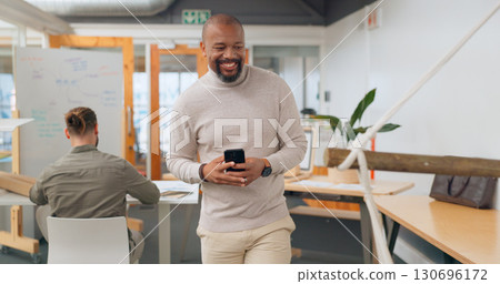 Business, smile and black man with a smartphone, office and social media with typing, connection and network. African person, employee and consultant with a cellphone, website information and post 130696172