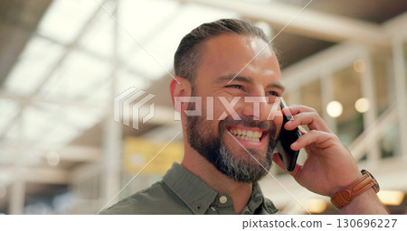 Face, smile and phone call with a business man in the office for communication or networking closeup. Contact, happy and planning with an employee speaking on his mobile for company negotiation 130696227