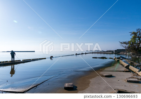 A view of Iida Port, where the embankment has become crumbling and seawater is invading A view of Iida Port, where the embankment has become crumbling and seawater is invading 130696693