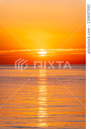 Beautiful red and orange sunrise over the sea. Beautiful red and orange sunrise over the sea. 130697892
