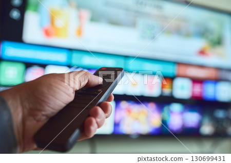 Relaxing at home, watching TV 130699431