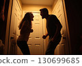 married couple is quarreling in the home. Silhouette of an aggressive husband and wife screaming. Family conflict and disagreements. The couple is fighting. Domestic violence and abusive relationships 130699685