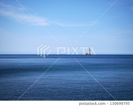 Candle Rock towering over the ocean 130699795