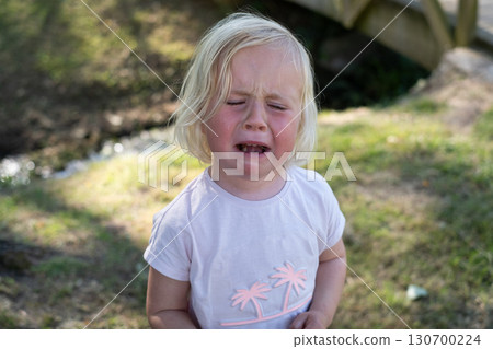 little girl crying from hurt feelings 130700224