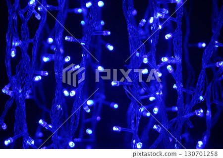 blue neon lights creating an atmosphere of coziness and approaching holiday 130701258