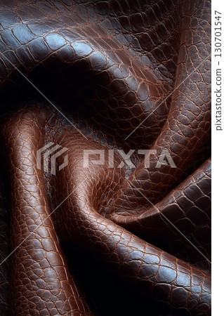 Brown crocodile leather with textured folds. Close-up of premium material for luxury goods. Perfect for high-end fashion and craft design. 130701547