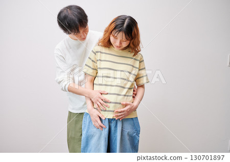 Couple facing each other, pregnant woman, maternity Couple facing each other, pregnant woman, maternity 130701897