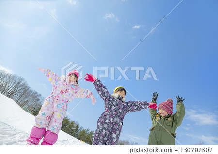 Children playing in the snow in the winter park Children playing in the snow in the winter park 130702302