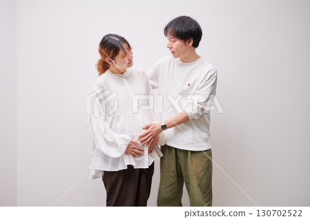 Couple facing each other, pregnant woman, maternity Couple facing each other, pregnant woman, maternity 130702522