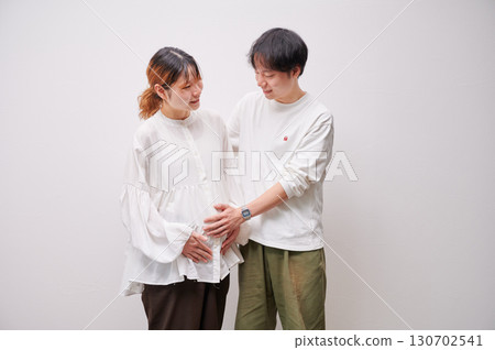 Couple facing each other, pregnant woman, maternity Couple facing each other, pregnant woman, maternity 130702541