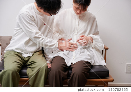 Couple facing each other, pregnant woman, maternity Couple facing each other, pregnant woman, maternity 130702565