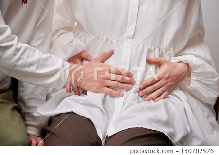 Couple facing each other, pregnant woman, maternity Couple facing each other, pregnant woman, maternity 130702576