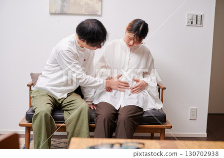Couple facing each other, pregnant woman, maternity 130702938