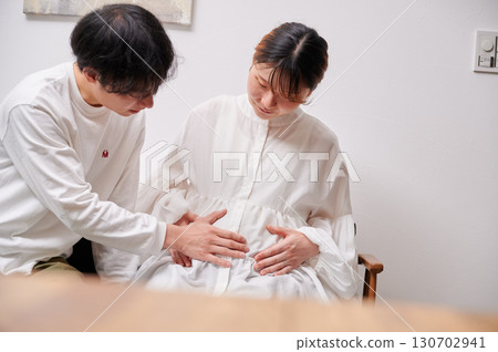 Couple facing each other, pregnant woman, maternity 130702941
