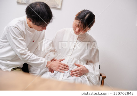 Couple facing each other, pregnant woman, maternity 130702942