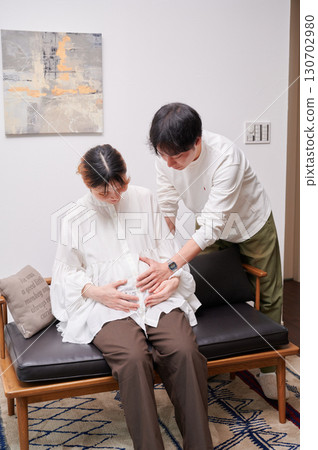 Couple facing each other, pregnant woman, maternity 130702980