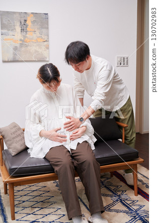 Couple facing each other, pregnant woman, maternity 130702983