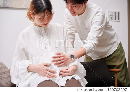 Couple facing each other, pregnant woman, maternity 130702997