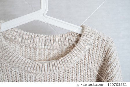 A cozy knitted sweater, perfect for staying warm in winter. A cozy knitted sweater, perfect for staying warm in winter. 130703281