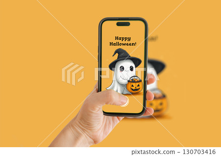 A Halloween ghost illustration on an orange background, captured with a mobile phone. A Halloween ghost illustration on an orange background, captured with a mobile phone. 130703416