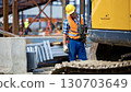 Construction worker wearing yellow helmet industrial site Construction worker wearing yellow helmet industrial site 130703649