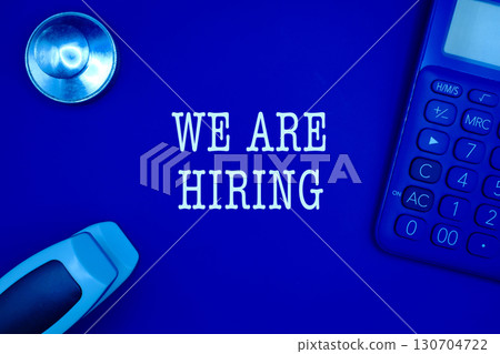 "We are hiring" text flat lay on the office workplace "We are hiring" text flat lay on the office workplace 130704722