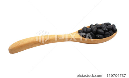 Side view of wooden spoon filled with black beans isolated on white background, suitable for concepts of organic food 130704787