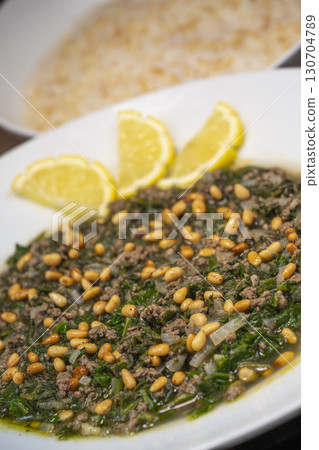Spinach or Sabanekh with chicken a Mediterranean dish served with rice Spinach or Sabanekh with chicken a Mediterranean dish served with rice 130704789