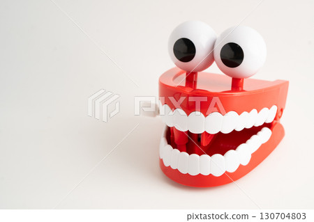 Funny red teeth with eye toy denture model for dental health care. Funny red teeth with eye toy denture model for dental health care. 130704803