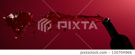 Red wine splash on a dark red background. Red wine splash on a dark red background. 130704966