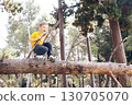 little cute boy climbing on tree, lifestyle people concept 130705070