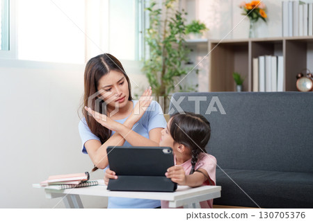 Parenting. Mother communicating boundaries with daughter during study time. Parenting. Mother communicating boundaries with daughter during study time. 130705376