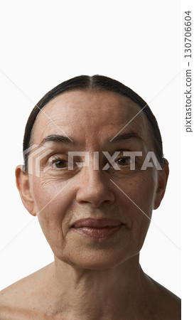 Portrait of elderly woman front view with natural skin detail 130706604