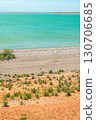 Red slopes and green steppe near the lake shore create a contrasting landscape 130706685