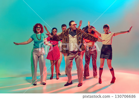 Man in fur coat leading synchronized retro dance group with confidence Man in fur coat leading synchronized retro dance group with confidence 130706686